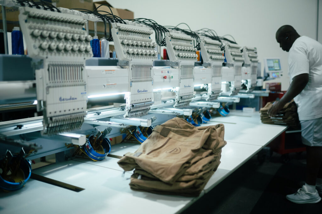 Barudan multi-head embroidery machine stitching custom logos in Naples, FL